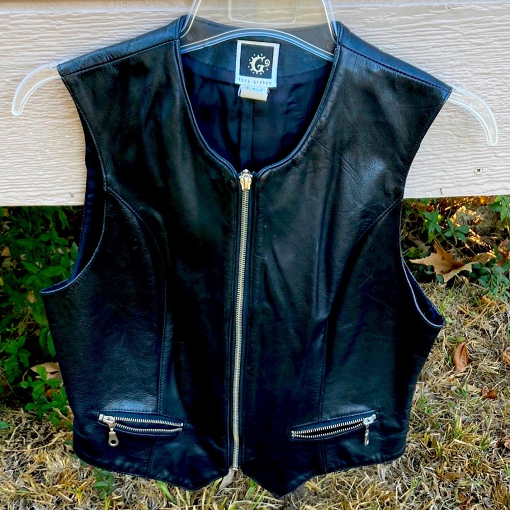 genuine leather vest made in USA.two front zip pockets like new completely lined
